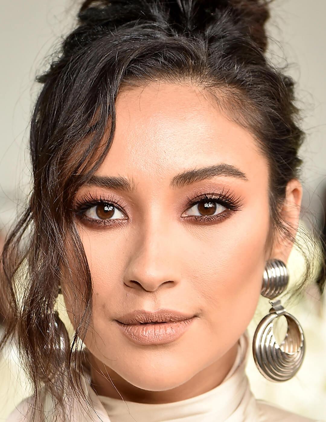Close-up of Shay Mitchell with a smoky eyeshadow makeup look paired with matte nude lips Desktop